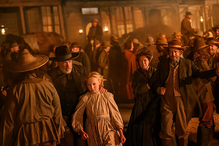 (from left, center) Captain Jefferson Kyle Kidd (Tom Hanks) and Johanna Leonberger (Helena Zengel) in News of the World, co-written and directed by Paul Greengrass.