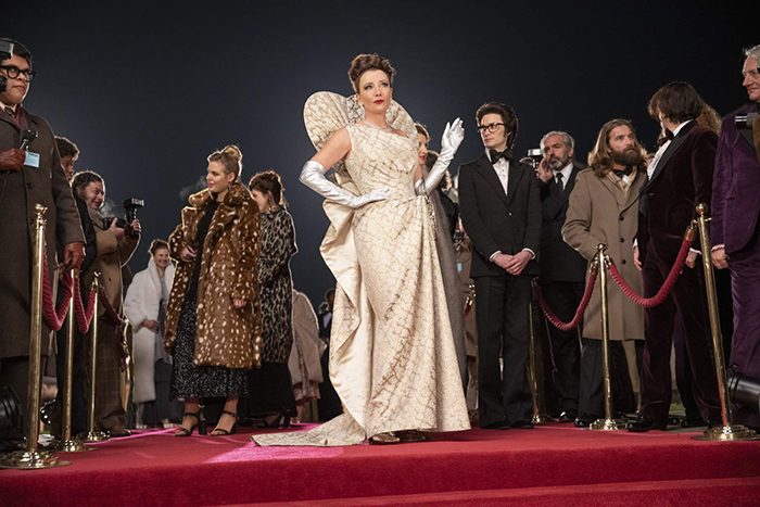Emma Thompson as the Baroness and Andrew Leung as Jeffrey in Disney’s live-action CRUELLA. Photo by Laurie Sparham. © 2021 Disney Enterprises, Inc. All Rights Reserved.