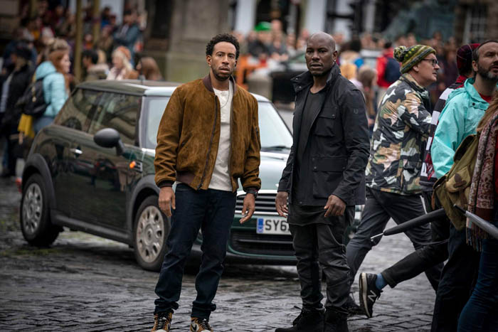 (from left, centered) Tej (Chris “Ludacris” Bridges) and Roman (Tyrese Gibson) in F9, directed by Justin Lin.
