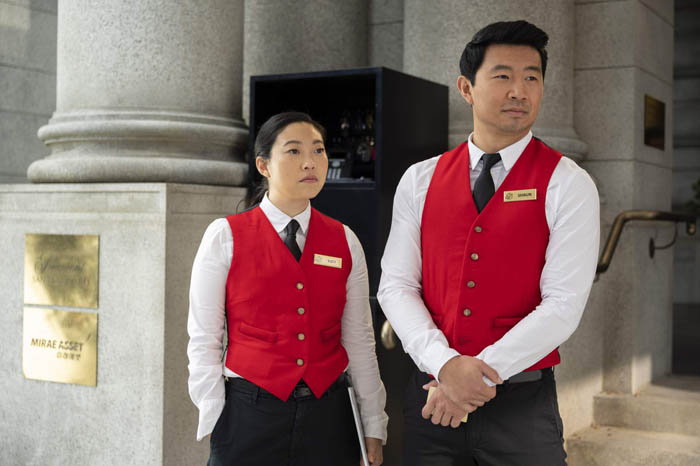 (L-R): Katy (Awkwafina) and Shang-Chi (Simu Liu) in Marvel Studios' SHANG-CHI AND THE LEGEND OF THE TEN RINGS. Photo by Jasin Boland. ©Marvel Studios 2021. All Rights Reserved.