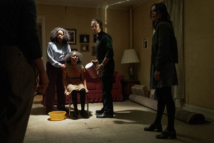 Archive 81. (L to R) Gameela Wright as Erica Lewis, Ariana Neal as Jess, Martin Sola as Father Russo, Dina Shihabi as Melody Pendras in episode 103 of Archive 81. Cr. Quantrell D. Colbert/Netflix © 2021