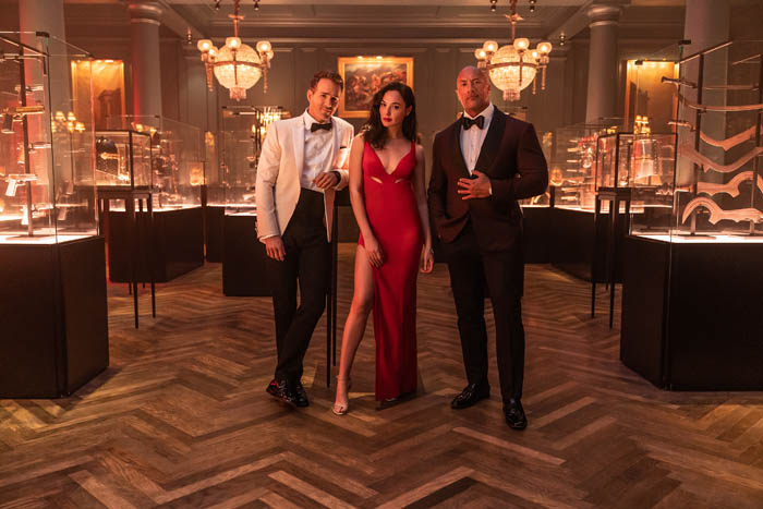 RED NOTICE - (L-R) RYAN REYNOLDS, GAL GADOT and DWAYNE ‘THE ROCK’ JOHNSON STAR IN NETFLIX’S RED NOTICE RELEASING NOVEMBER 12, 2021. WRITTEN & DIRECTED BY RAWSON MARSHALL THURBER. Cr: Frank Masi/NETFLIX © 2021