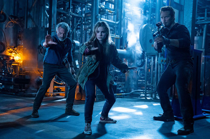 (from left) Dr. Alan Grant (Sam Neill), Maisie Lockwood (Isabella Sermon) and Owen Grady (Chris Pratt) in Jurassic World Dominion, co-written and directed by Colin Trevorrow.