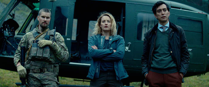 Troll (L to R) Mads Sjøgård Pettersen as Captain Kristoffer Holm, Ine Marie Wilmann as Nora and Kim S. Falck-Jørgensen as Andreas Isaksen in Troll Cr. Courtesy of Netflix © 2022