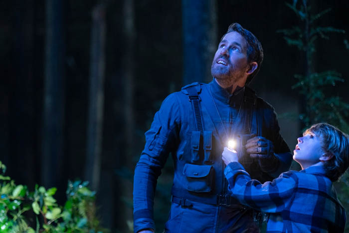 The Adam Project (L to R) Ryan Reynolds as Big Adam and Walker Scobell as Young Adam. Cr. Doane Gregory/Netflix © 2022