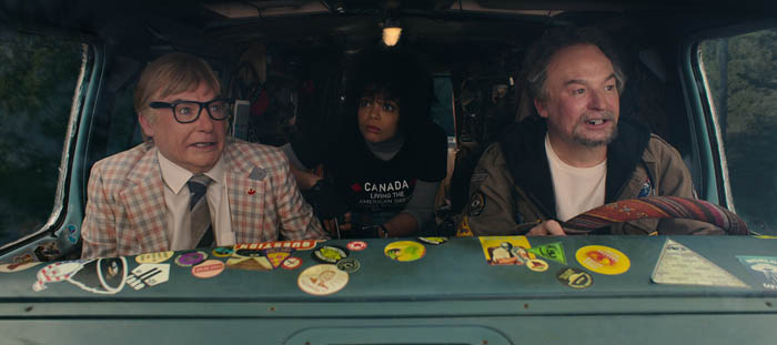 The Pentaverate. (L to R) Mike Myers as Ken Scarborough, Lydia West as Reilly Clayton, Mike Meyers as Anthony Landsdowne in The Pentaverate. Cr. Courtesy of Netflix © 2022
